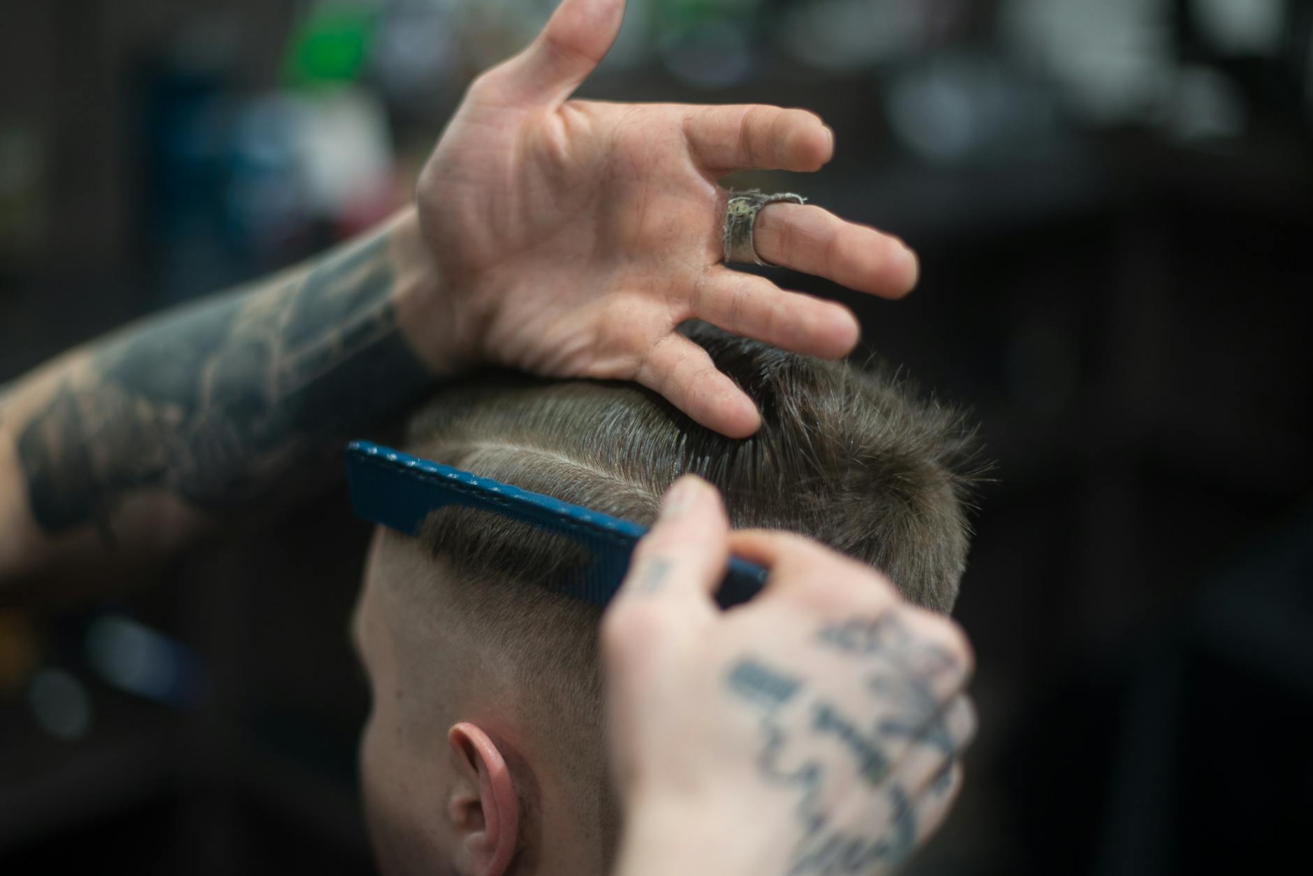 person combing person s hair